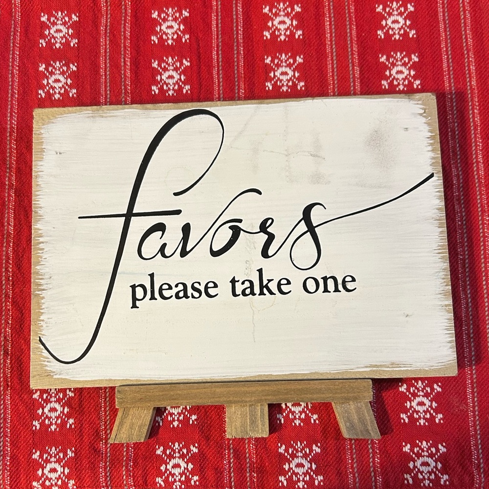 White and Black Favor Sign on Easel